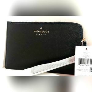 NWT kate spade staci med L zip wristlet. Black in color